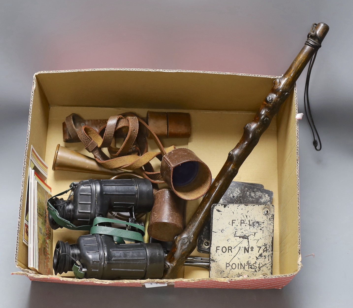 A group of mixed collectibles, including SAS binoculars.